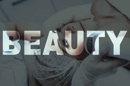 Young Woman Came To Beauty Salon. Hair Removal. Laser Depilation. Laying On Couch. Preparing For The Procedure. Modern Spa Salon. Healthy Lifestyle. Cosmetology Department. Hygiene Control.の写真素材