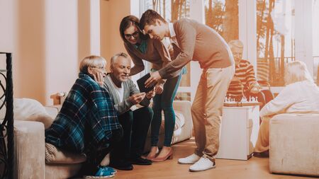 Man and Woman Watch Something on Tablet. Nursing Home.の写真素材