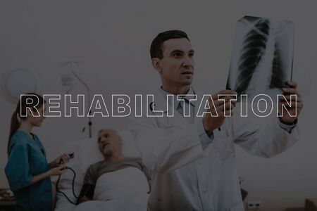 Collage Qualified Doctor Look at Chest X-Ray Scan. Aged Man Lying in Hospital Bed. Nurse Medical Checkup.の写真素材