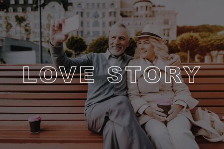 Pensioners Couple Selfie. Woman in Hat. Pensioners Rest in Park. Old Couple Bubbly Relationships. Couple Love Story. Woman Smiling. Old People on Date. Retired People Sit on Bench.