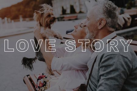 Old People on Date. Woman Smiling. Two Pensioners with Little Dog. Old Couple Love Story. Old Couple Bubbly Relationships. Retired People Happy Together. Retired People Sit on Bench.