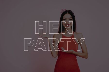 Girl in Red Dress. Pink Background. Celebrating Women's Day. Hen Party. Smiling Girl . Surprised Woman. Happy Woman. Happy Emotions.の写真素材