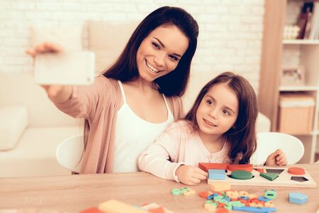 Mother Teaches Daughter. Educational Games. Learning Child at Home. Cubes and Puzzles. Child...