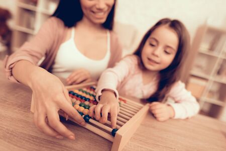 Woman Teaches Girl. Educational Games. Girl Learning how to Count.の写真素材