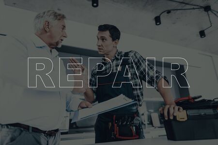 Men Argue About the Cost. People in Modern Kitchen. Tool Box on Table.の写真素材