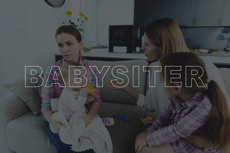 Mother Scolds a Babysitter and Gesticulating. Sad Nanny Listens a Strong Mother.の写真素材