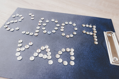 Metal Pins Making Inscription Fools Day on Tablet. April Fools Day. April Jokes. Holidays and Celebration Concepts. Jokes in Office Concept. Metal Stationery on Table. Wooden Table.の写真素材