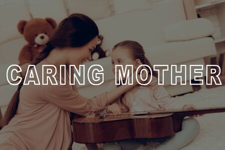 Caring Mother. Kids Home Games. Rest Home. Child Development. Mom and Daughter Play. Happy Mom and Child in Pajamas.の写真素材