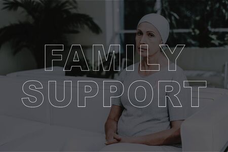 Family Support. Sick Mature Woman Sitting on Sofa. Senior Sick Woman feeling Unwell waiting in...