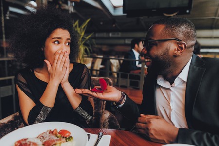 African Handsome Man Proposing to Girlfriend. Romantic Couple in Love Dating. Cutel Man and Girl in...