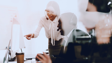 Team of Managers Working in Modern Call Center. Manager with Computer. Businessman on Workplace. Consultant with Microphone. Customer Service Concept. Woman in Headphones. Operator in Office.の写真素材