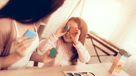 Mother Teaches Daughter. Educational Games. Learning Child at Home. Cubes and Puzzles. Child...