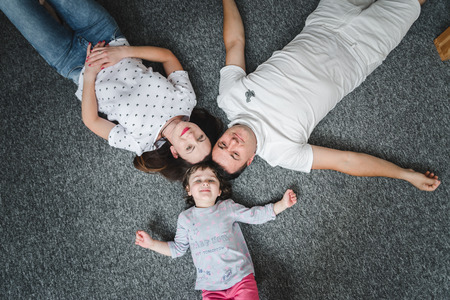 Smiling happy family and young funny daughter. Family concept.の写真素材