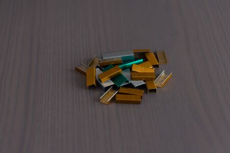 metal staples on wooden backgroundの写真素材