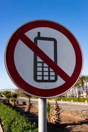 Road sign, sign No Mobile phone on the road backgroundの写真素材