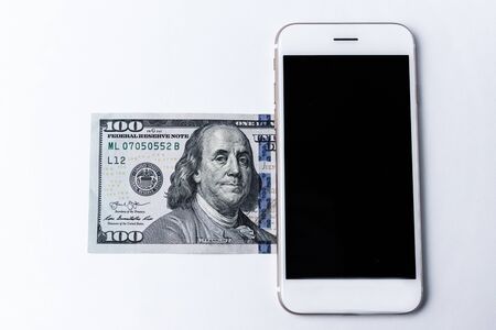 Smartphone and dollars. Mobile payment concept.の写真素材