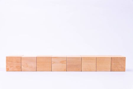 Wooden toy cubes isolated on a whiteの写真素材