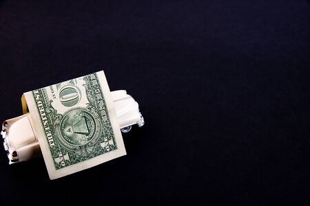 Dollar bill roof covers white car toy. Car insurance concept