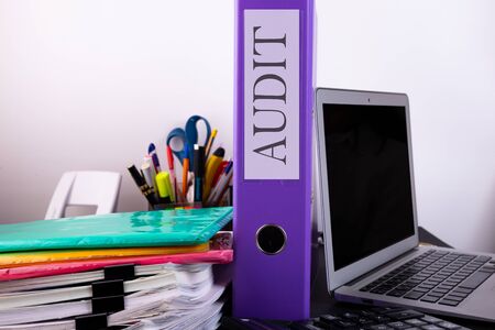 Audit concept. Accounting packs of documents on the table and laptop.の写真素材