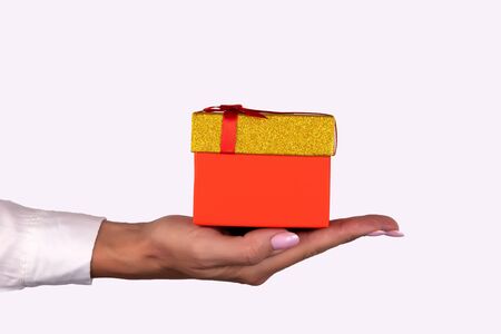Hands holding gift box isolated on white background. High resolution product