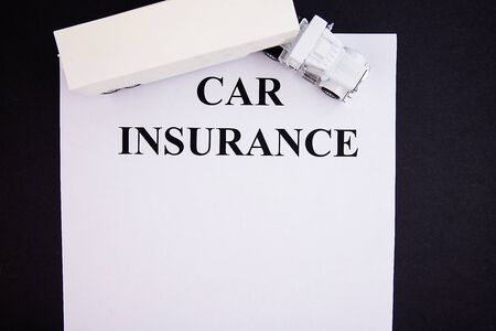 Insurance form with truck on a black backgroundの写真素材
