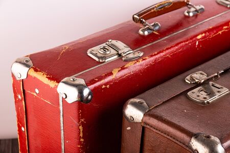 Vintage suitcases stand on a table on a light background.の写真素材