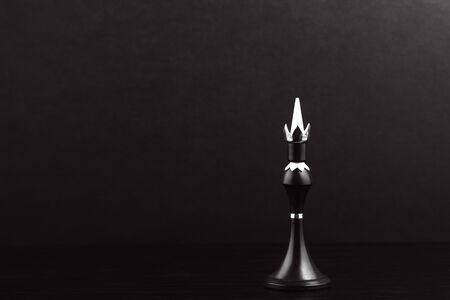 Black chess pieces on a chessboard on a dark background. Business concept. Game, strategy, wisdom, determination.の写真素材