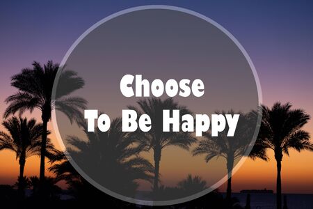 Inspirational Motivational Quote - Choose To Be Happy written against the sky and palm branches.の写真素材