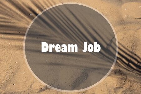Dream Job written on sand at beachの写真素材