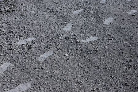 Human shoes set footprints in the wild sand, environmental pollution. Textureの写真素材