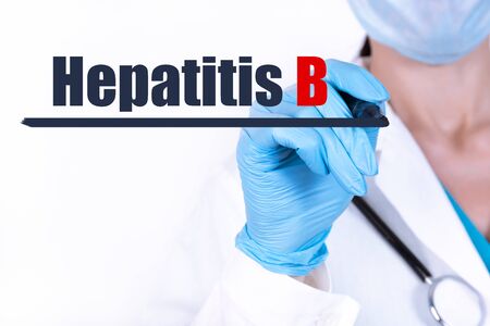 Doctor writing word Hepatitis B with marker Medical conceptの写真素材
