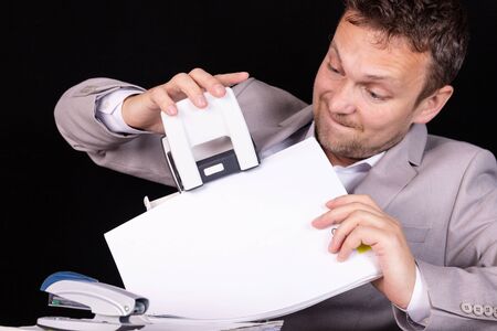 Office worker with emotion on his face at work. Business concept.