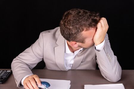 Businessman is disappointed with problems in working. Business concept.の写真素材