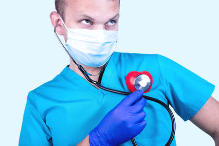 Cardiovascular disease prevention medical concept. The doctor measures pressure with a tonometer.の写真素材