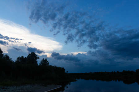 Beautiful evening sunset. landscape with the river.