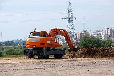 Excavator bucket during road and construction works.