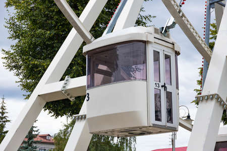 Ferris wheel ride in a public park. The concept of entertainment, recreation and travel.