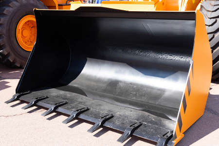 Tractor loader, yellow excavator, construction machinery, bucket equipment.