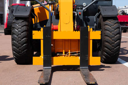 Forklift. The concept of moving cargo from a warehouse to a car.の写真素材