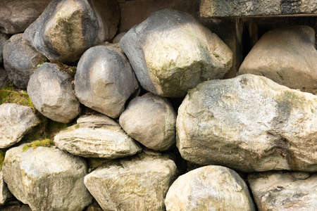Large stones were piled together to form a stone wall.の写真素材