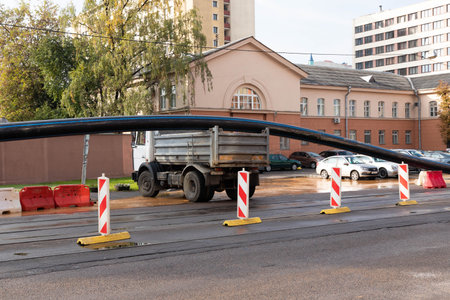 Minsk, Belarus - October 20, 2020: Arranged PVC of water pipes are assembled and placed in trench on building site.のeditorial素材