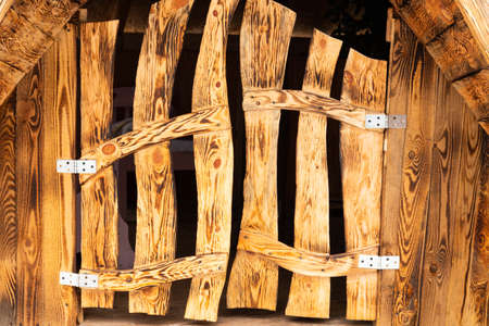 Wooden fairy door. beautiful natural background. door as a decorative element. fairy house. close-up, place for text.の写真素材