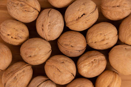 IRipe walnuts in the shell, the theme of healthy eating, vegetarianism, raw food diet.