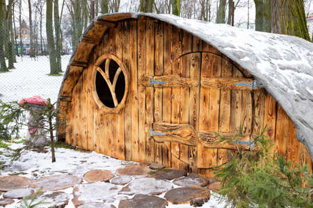 Moscow, Russia - January 2, 2021 an amusement park with wooden fairy-tale houses, a playground with sculptures of fairy-tale characters.のeditorial素材