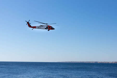 Sharm El Sheikh, Egypt - January 21, 2021: A Coast Guard helicopter with soldiers flies over the coast of the Red Sea.のeditorial素材