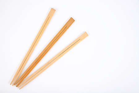 Wooden chopsticks on a white background. Copy space.の写真素材