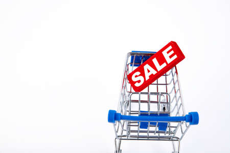 shopping cart, e-commerce, sale text on white background. Copy space.の写真素材