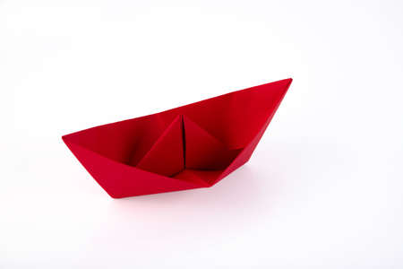 Red paper ship made of paper isolated on white background. Copy space.の写真素材