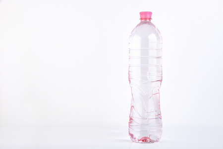 Plastic bottle of drinking water isolated on whiteの写真素材