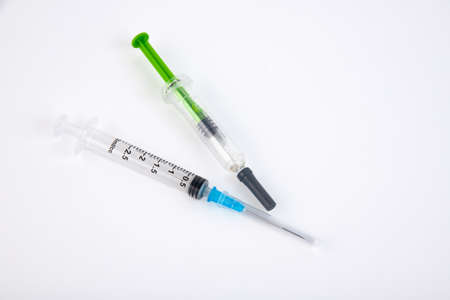 Two medical syringes on a white background. Copy space.の写真素材